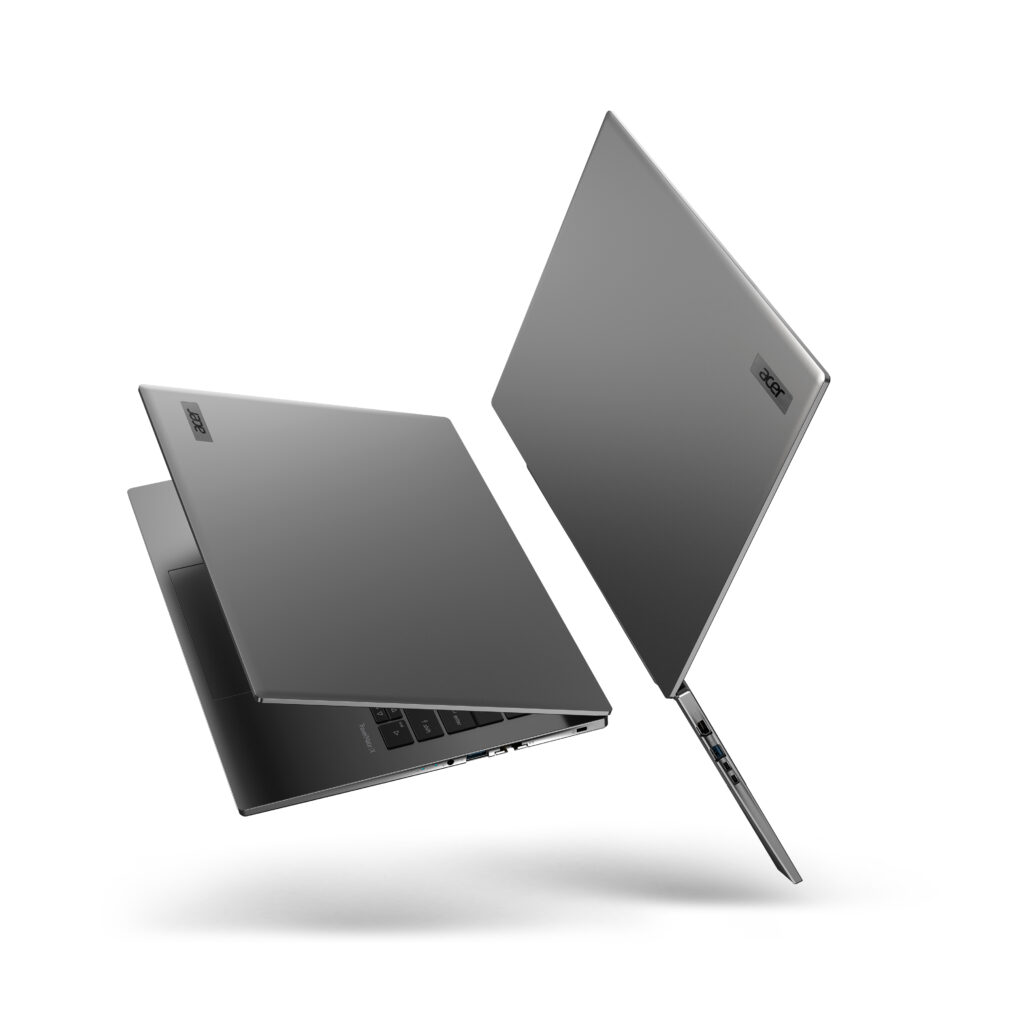 Two laptops floating back to back, both open