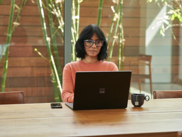 Woman working at a laptop computer.
