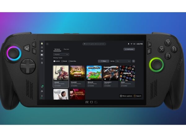 Photo of a handheld PC gaming device with game titles in tiles on screen