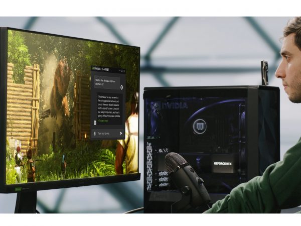 Man looking at screen with PC tower next to him