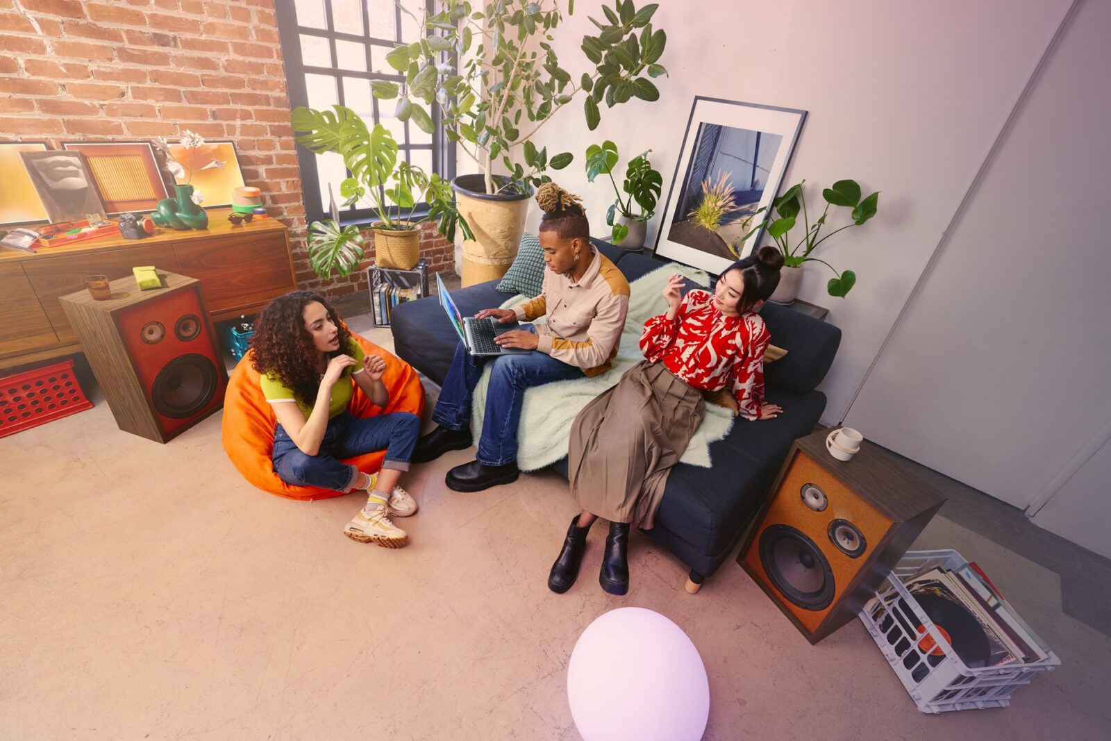 Three people lounging in a living room.