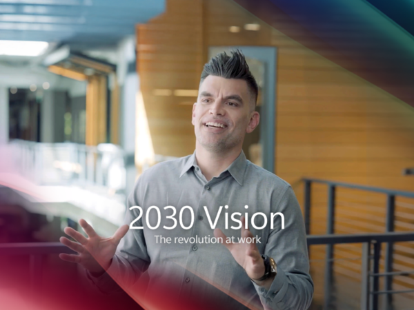 A man talking, with text overlaid reading 2030 vision, the revolution at work.
