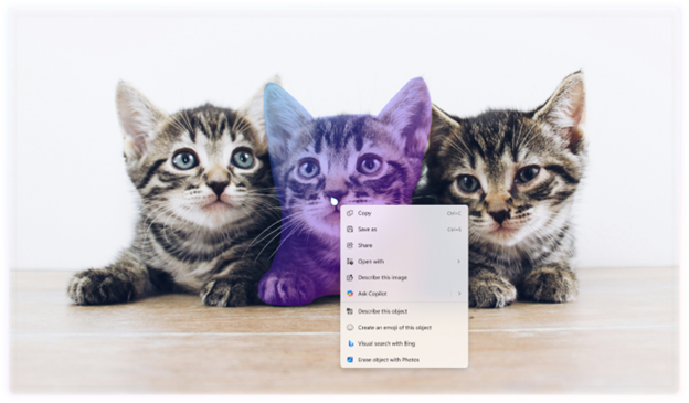 Image of three kittens sitting on a wooden surface with a computer context menu overlaid on the center kitten. The context menu includes options like "Copy," "Paste," and "Properties," along with other options like “Ask Copilot”.