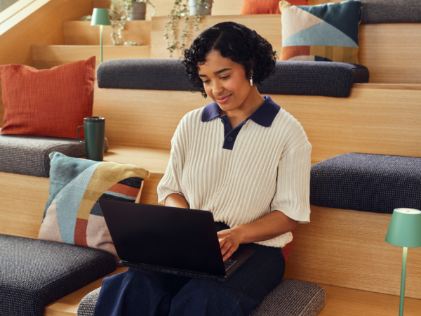 Woman working on a laptop computer.
