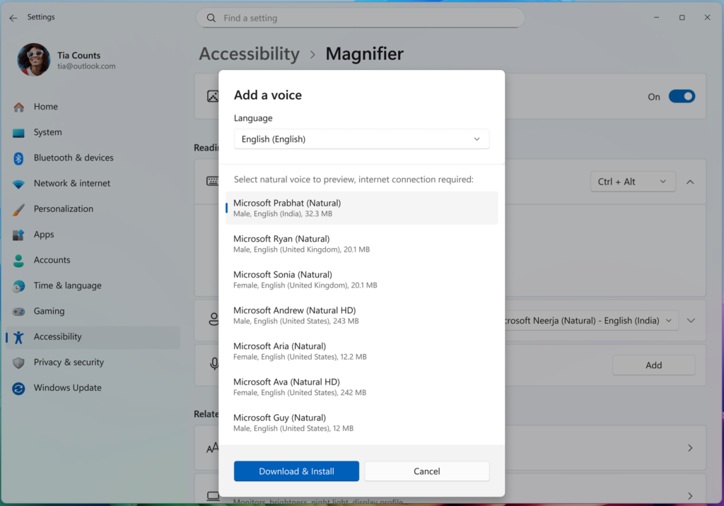 A screenshot of the settings menu on Windows selected to "Magnifier" settings. A user has selected the voices option in the settings menu and sees an overlay that lets them add a voice. The user is presented with options for Natural and Natural HD voices.