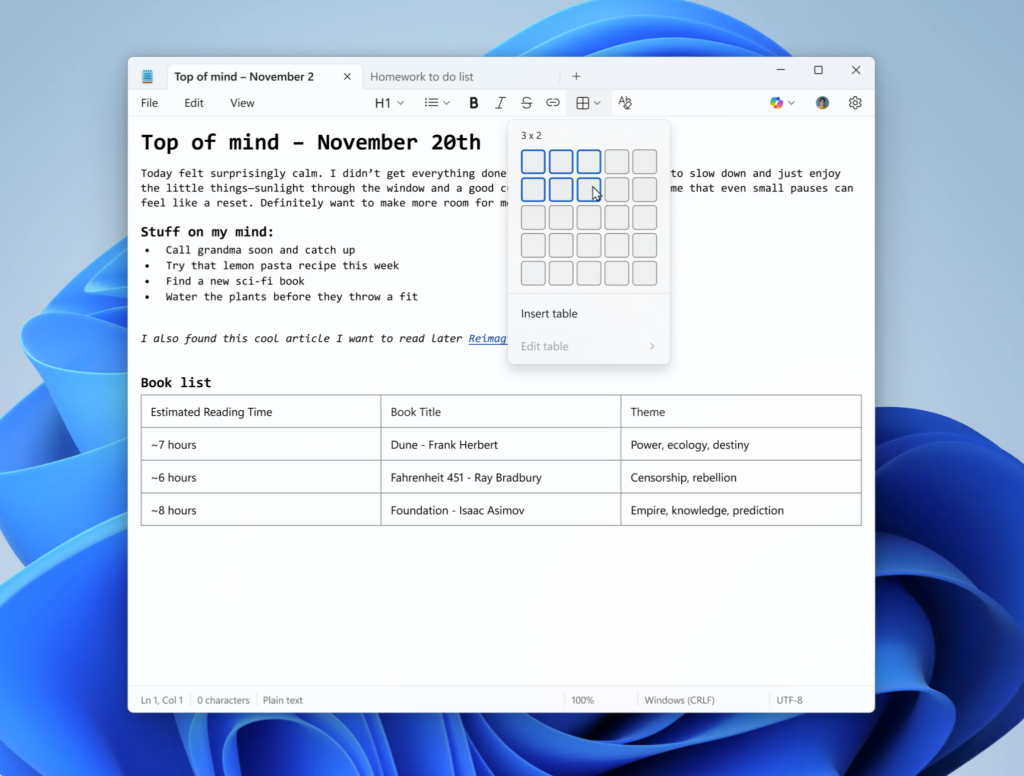 Notepad open with table as part of formatted content with menu open to add new table in the formatting toolbar.