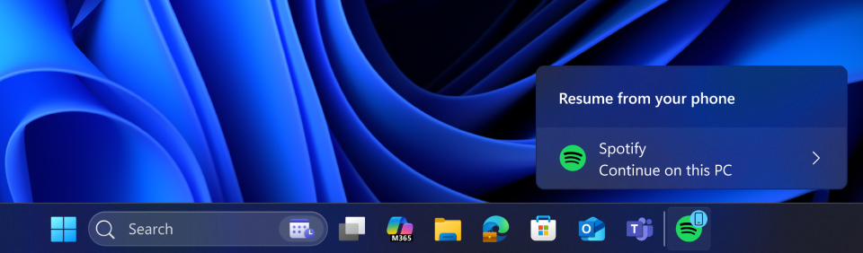 A cross-device resume taskbar alert indicating that you can continue using Spotify app from your phone, now on your PC.