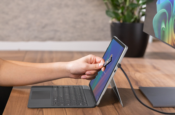 Hand reaching out to laptop