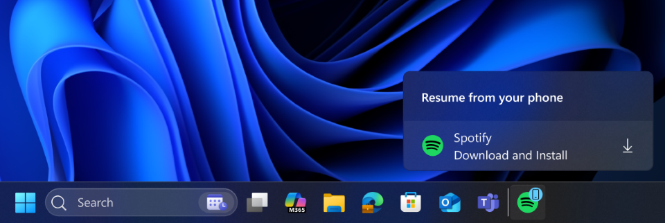 A cross-device resume taskbar alert indicating that you can download and install Spotify app to resume on your PC.